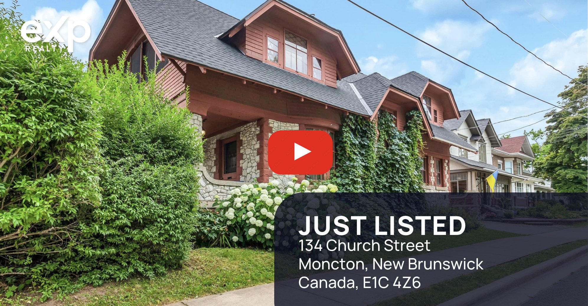 Video thumbnail showing the exterior of a heritage-style red and stone home at 134 Church Street in Moncton, New Brunswick. 'Just Listed' text and address overlay with eXp Realty branding and a YouTube play button centered on the image.