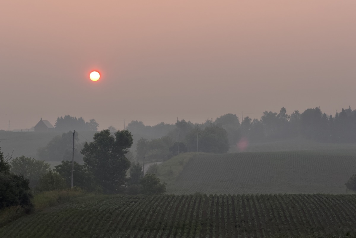 King Township - Hazy Morning with an orangey sky from wildfire smoke.