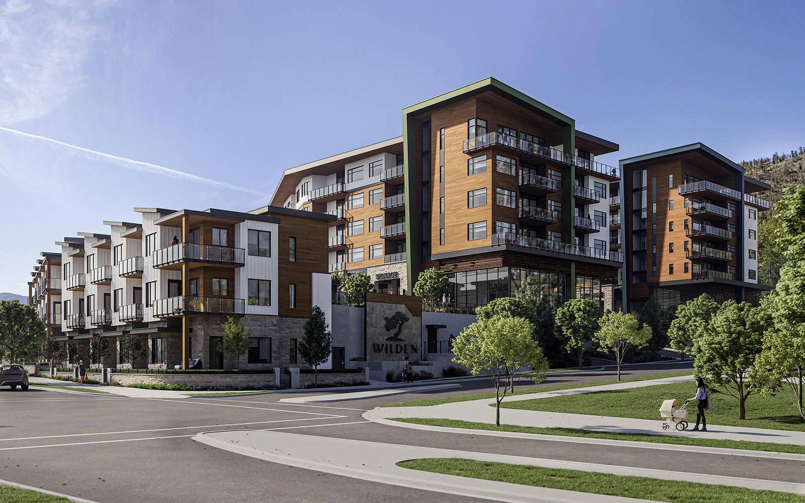 Architectural rendering of the future Wilden Market Square residential area, featuring modern townhomes and multi-family buildings with wood and stone finishes, wide sidewalks, and integrated green spaces. Future School and community space.