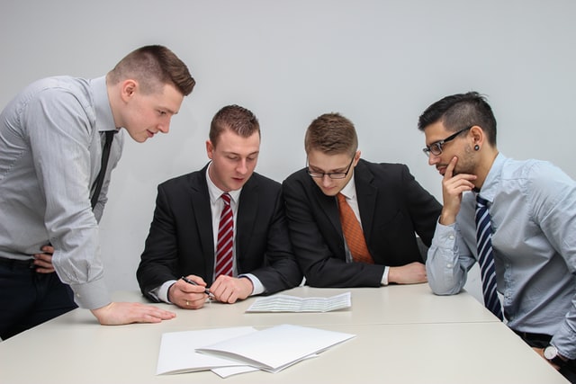 Four men sitting at a table talking about tips for Mississauga first time buyers.