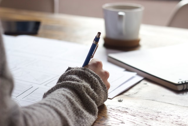 A person writing.