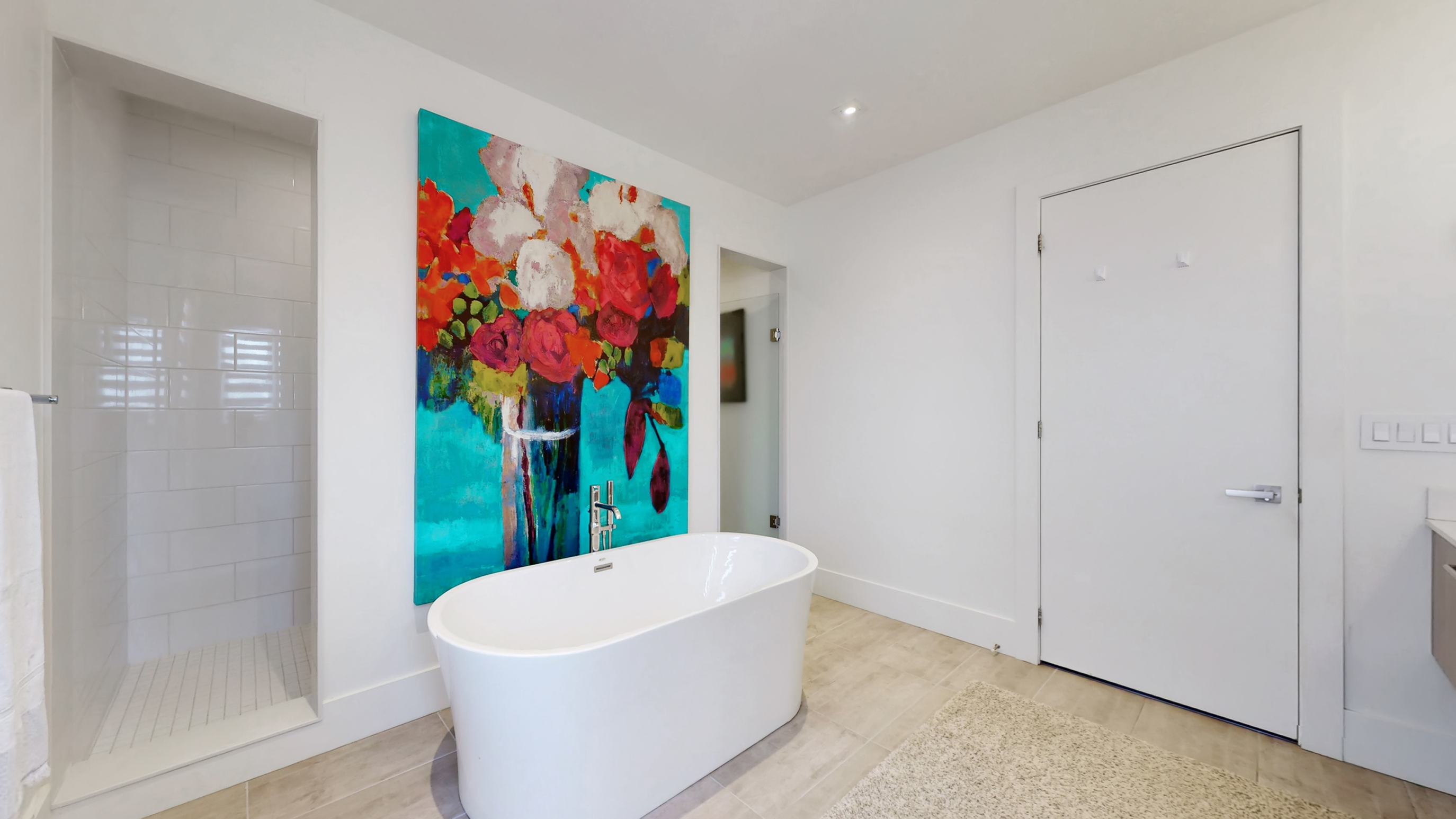 Luxury primary ensuite bath with private toilet chamber and walk-in shower area