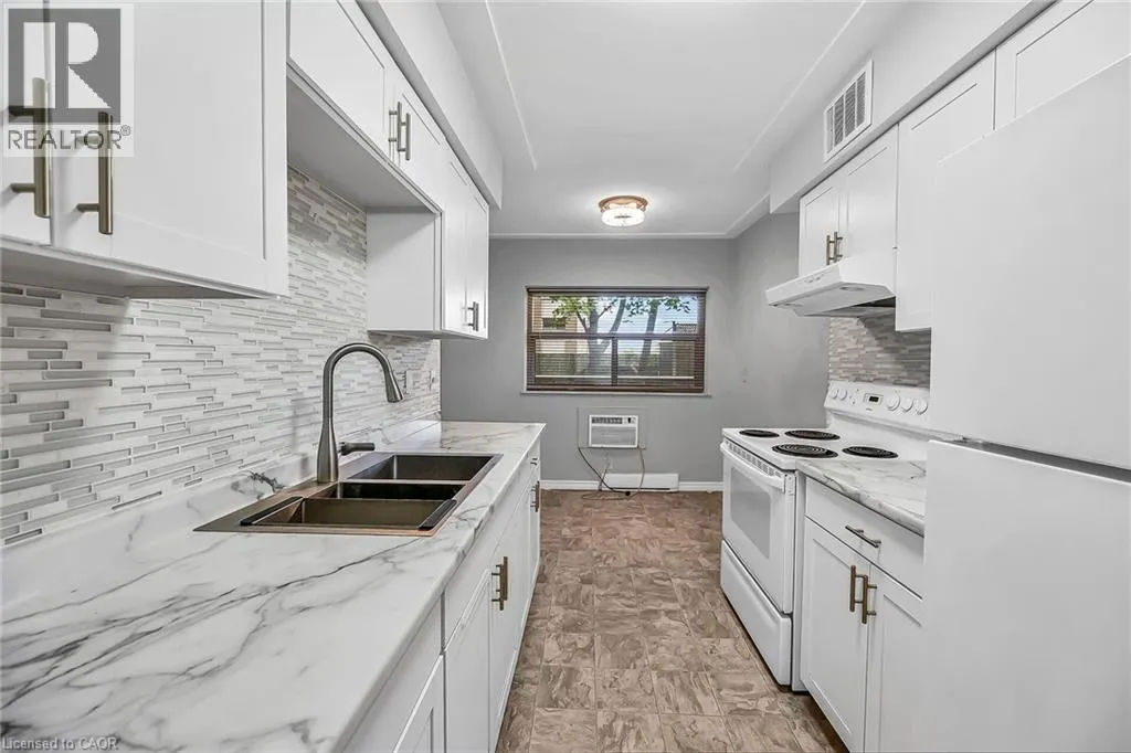 11 WOODMAN Drive S Unit# 103, #103