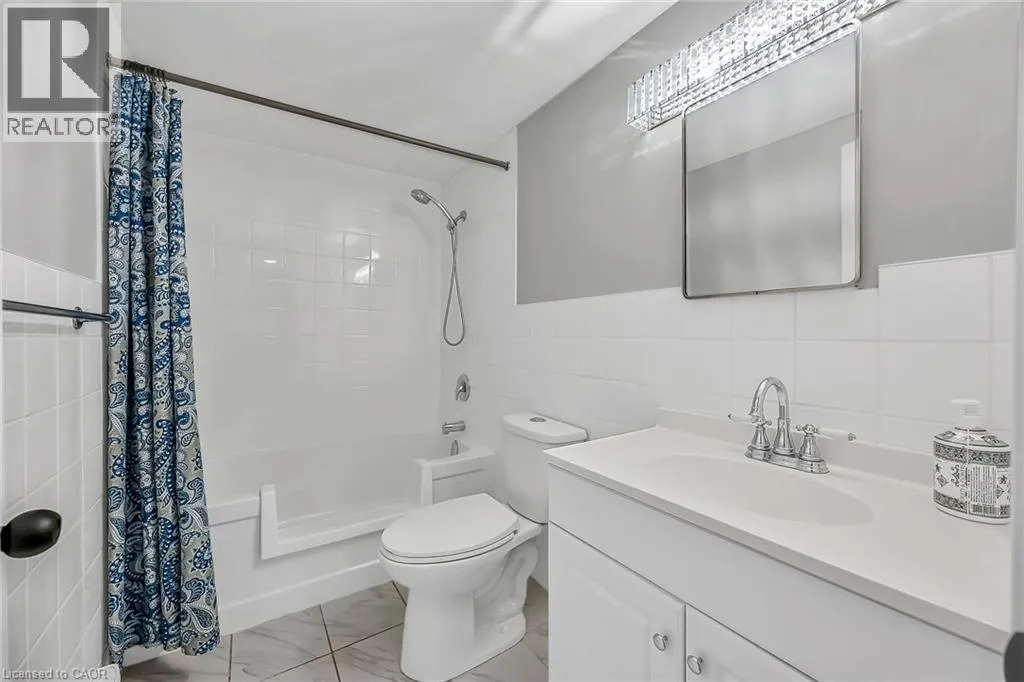 11 WOODMAN Drive S Unit# 103, #103