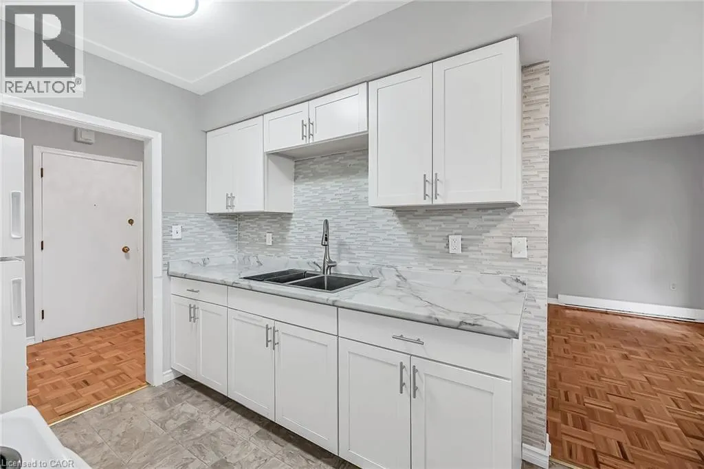 11 WOODMAN Drive S Unit# 103, #103
