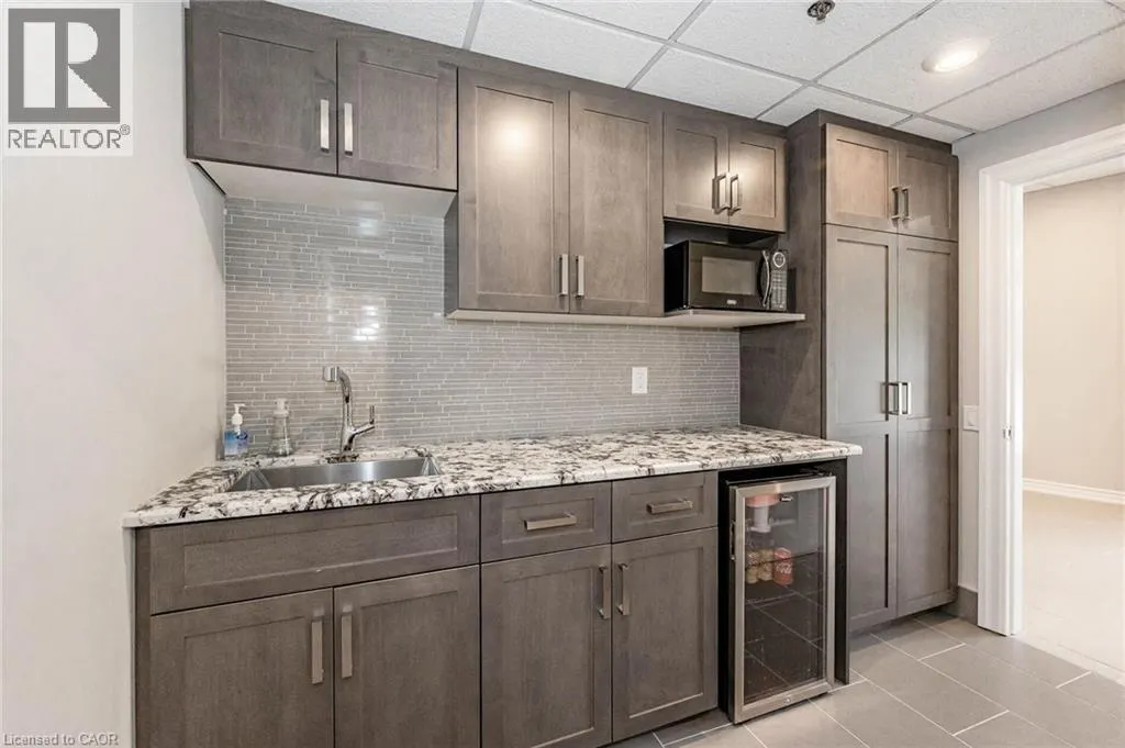 150 E WELLINGTON Street E Unit# 104 #104