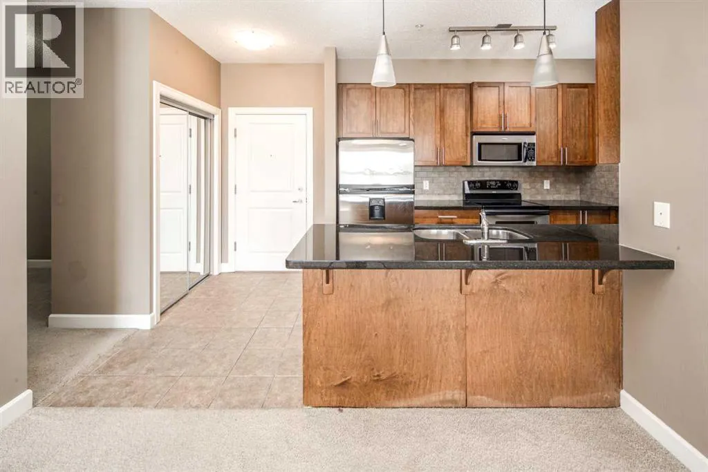 203, 88 Arbour Lake Road NW