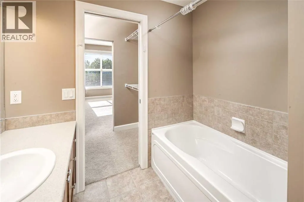 203, 88 Arbour Lake Road NW