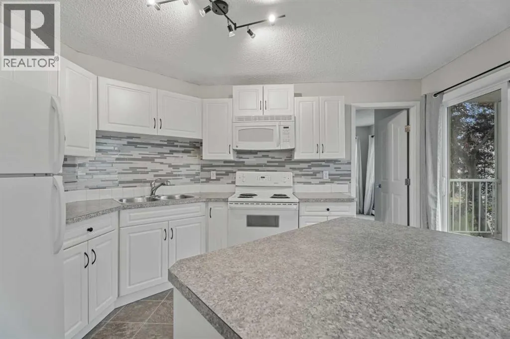 202, 7202 Valleyview Park SE