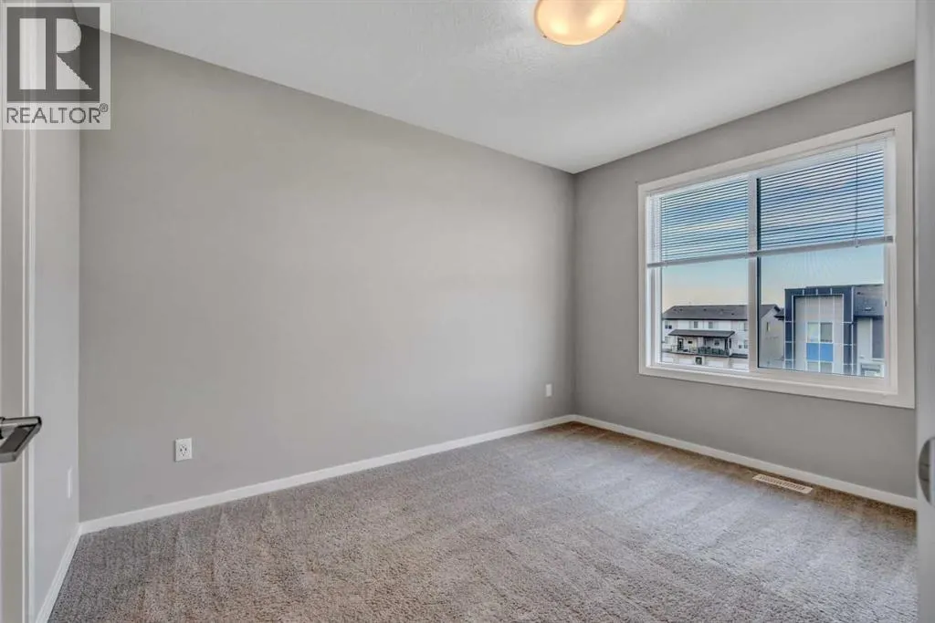 203, 140 Redstone Walk NE