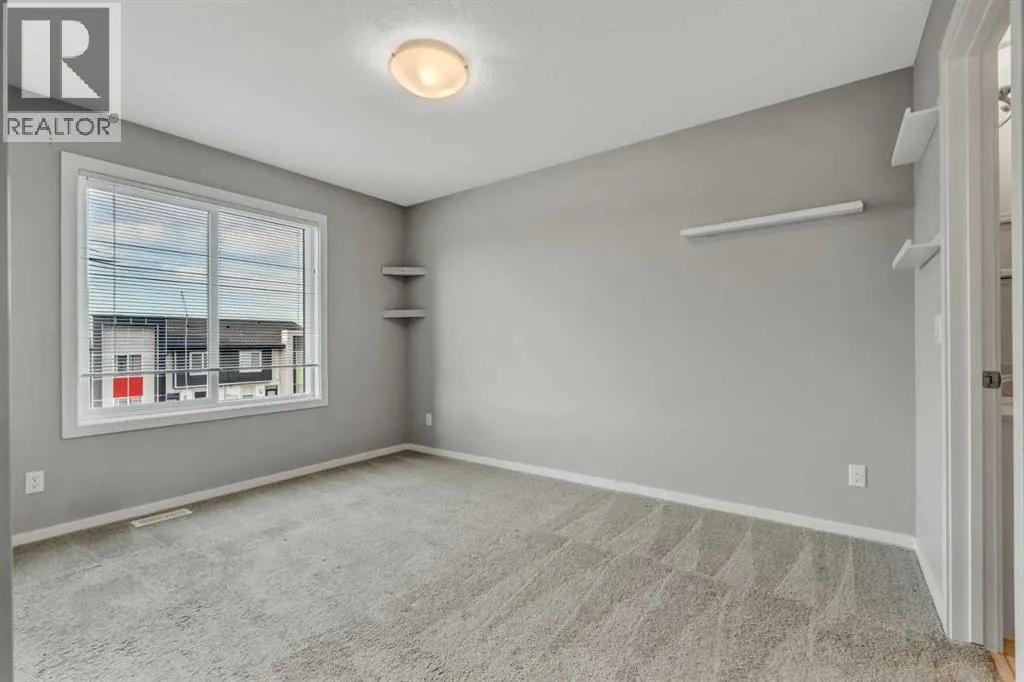 203, 140 Redstone Walk NE