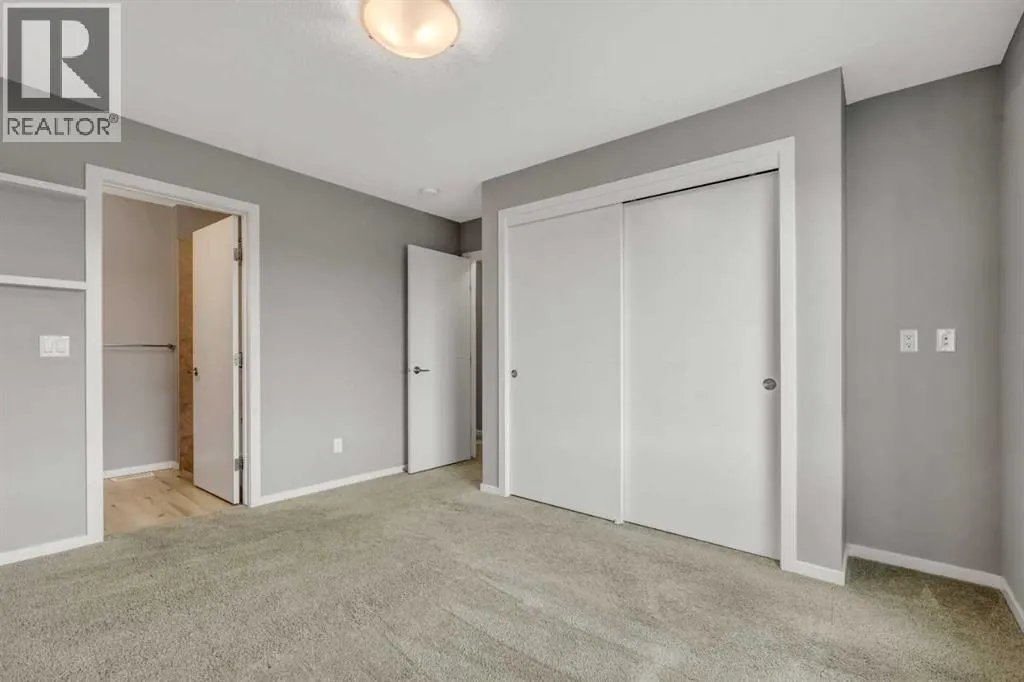 203, 140 Redstone Walk NE