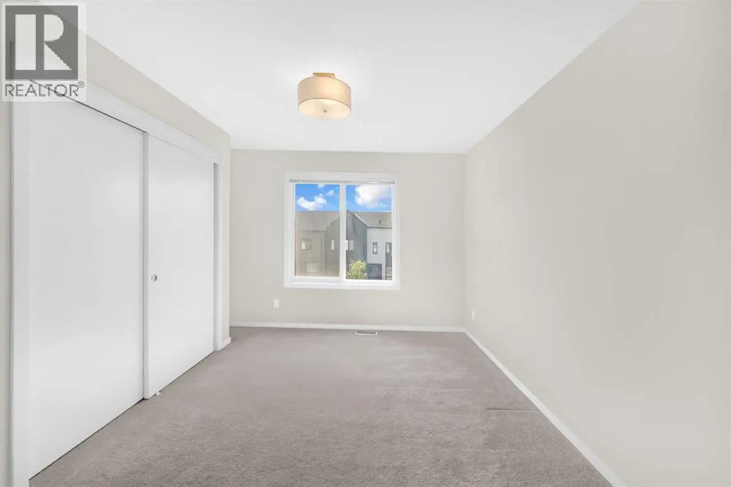 203, 525 Redstone Walk NE