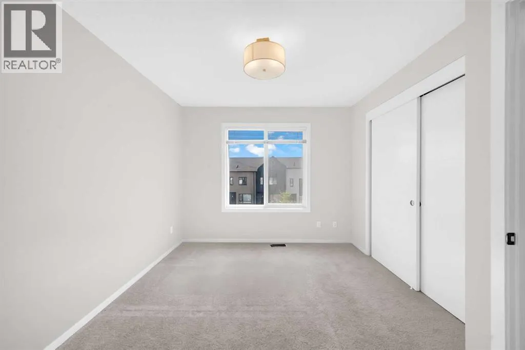 203, 525 Redstone Walk NE