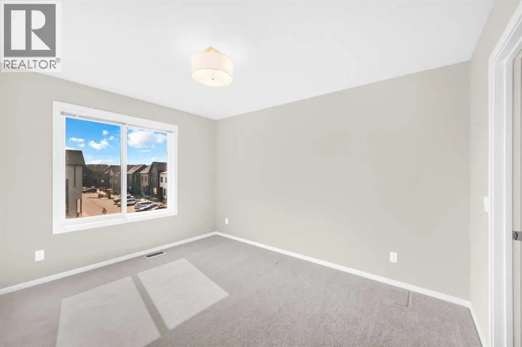 203, 525 Redstone Walk NE