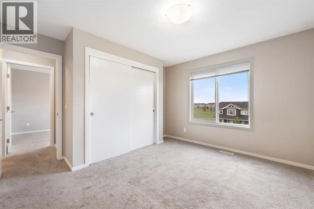 203, 335 Redstone Walk NE