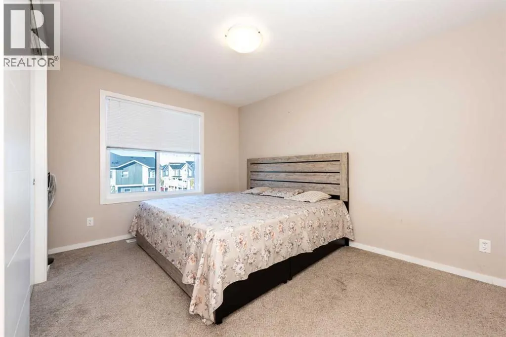 203, 225 Redstone Walk NE