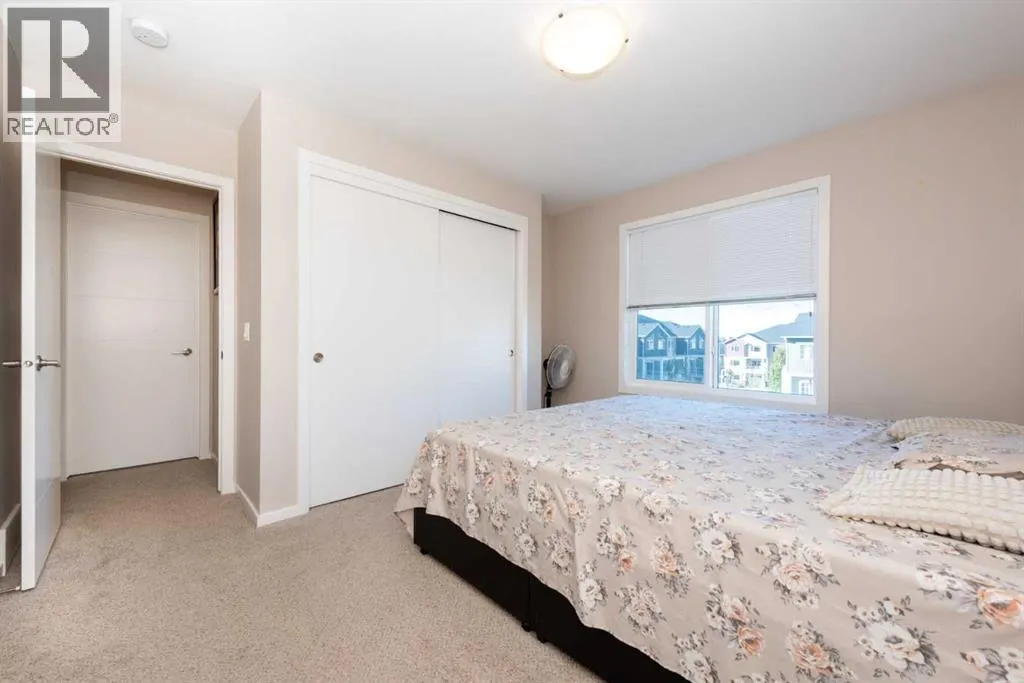 203, 225 Redstone Walk NE
