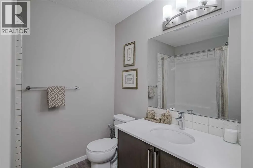 203, 130 Redstone Walk NE