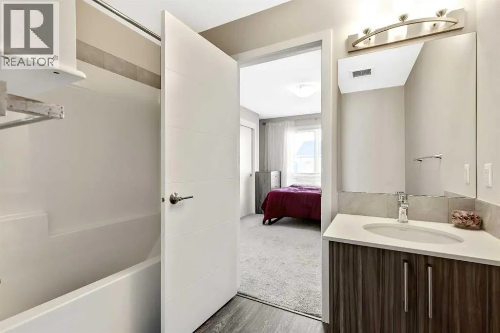 203, 245 Redstone Walk NE