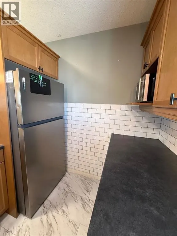 F103, 8640 103 Avenue