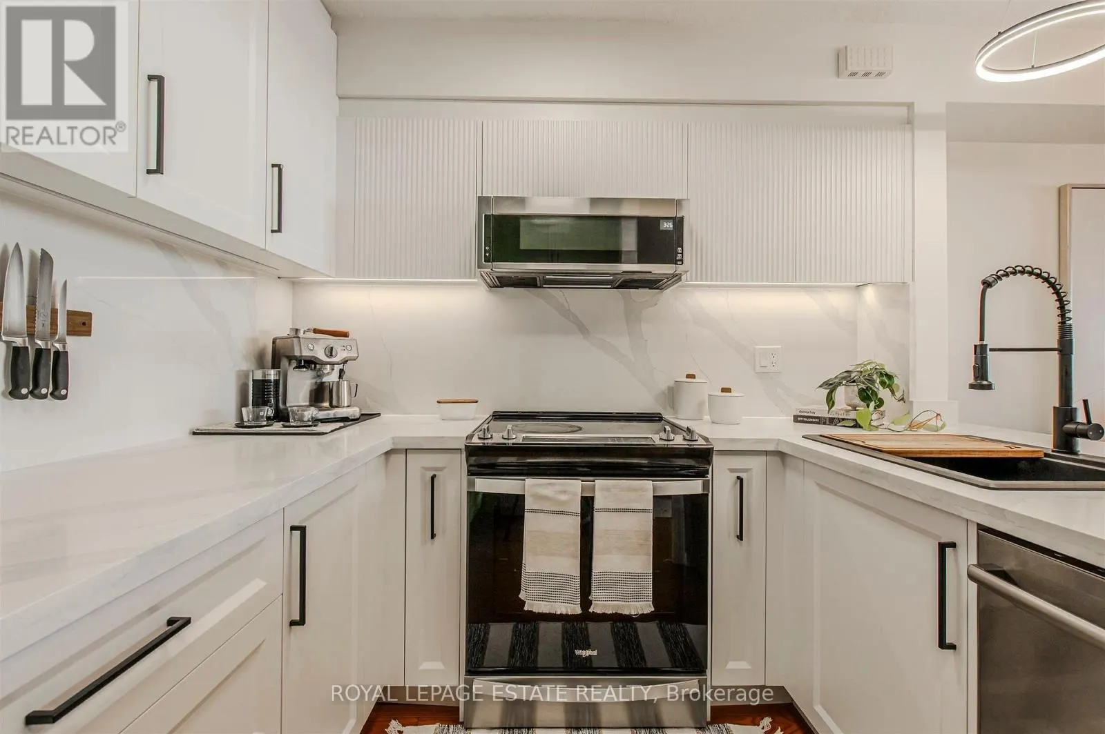 32 - 1209 QUEEN STREET E