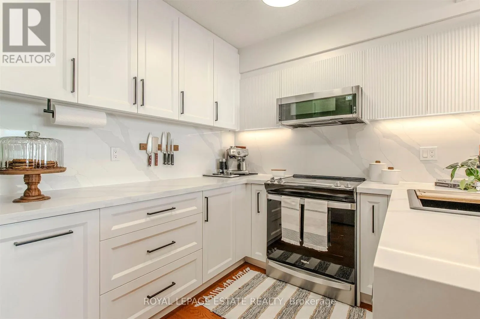 32 - 1209 QUEEN STREET E