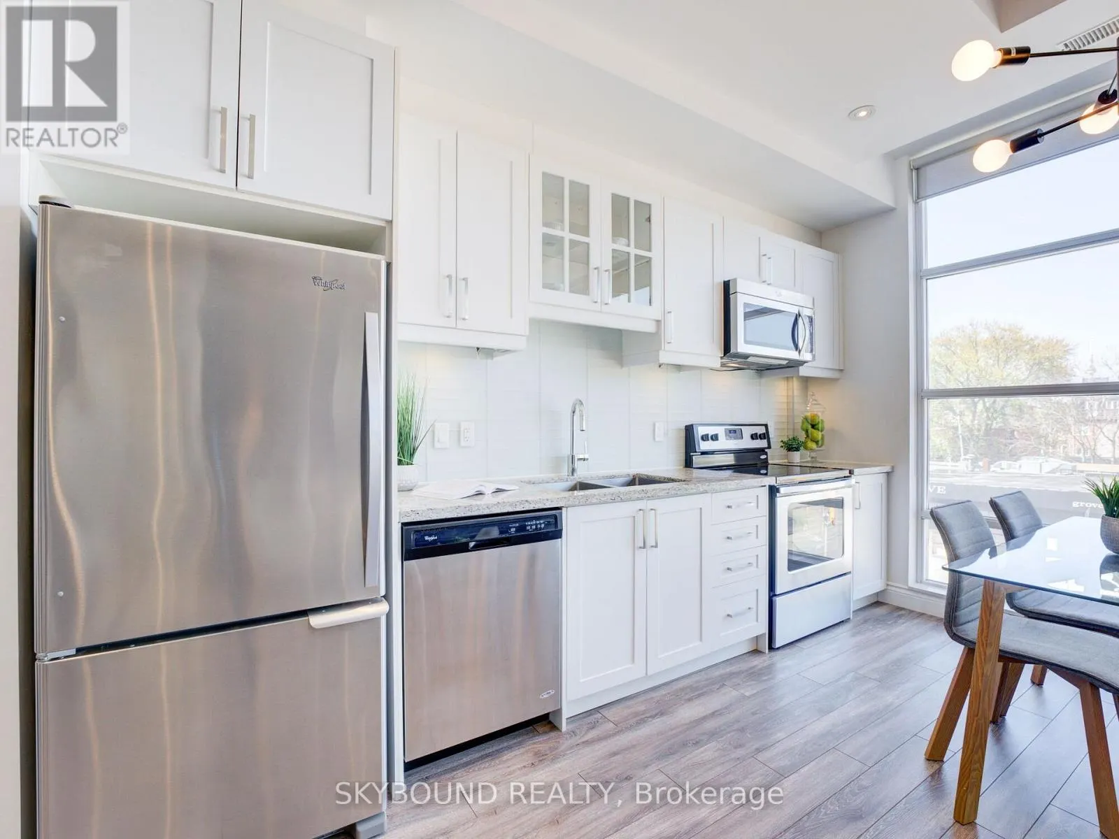 302 - 1003 QUEEN STREET E