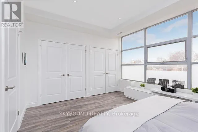 303 - 1003 QUEEN STREET E