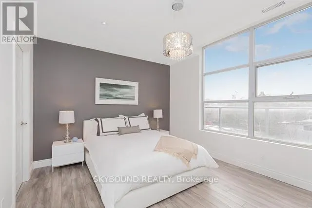 303 - 1003 QUEEN STREET E