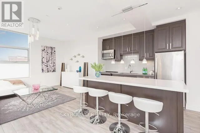 303 - 1003 QUEEN STREET E