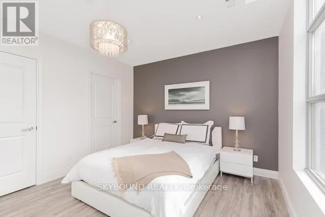 303 - 1003 QUEEN STREET E
