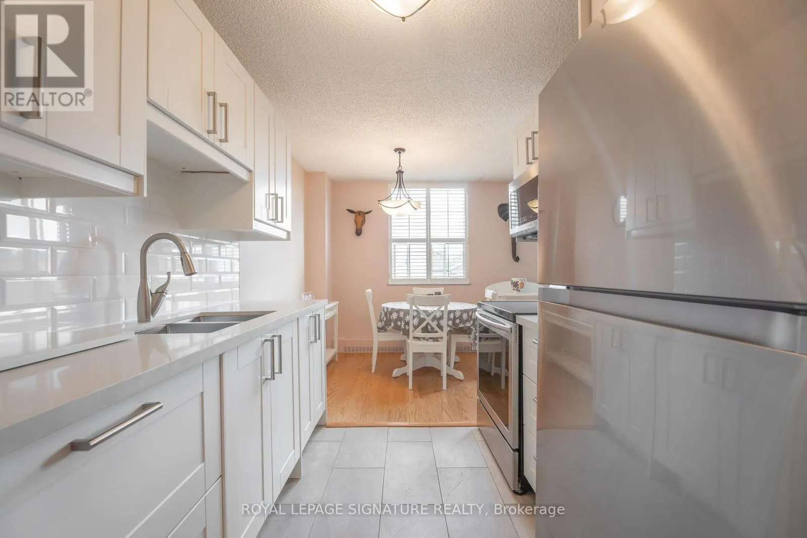 211 - 1071 WOODBINE AVENUE