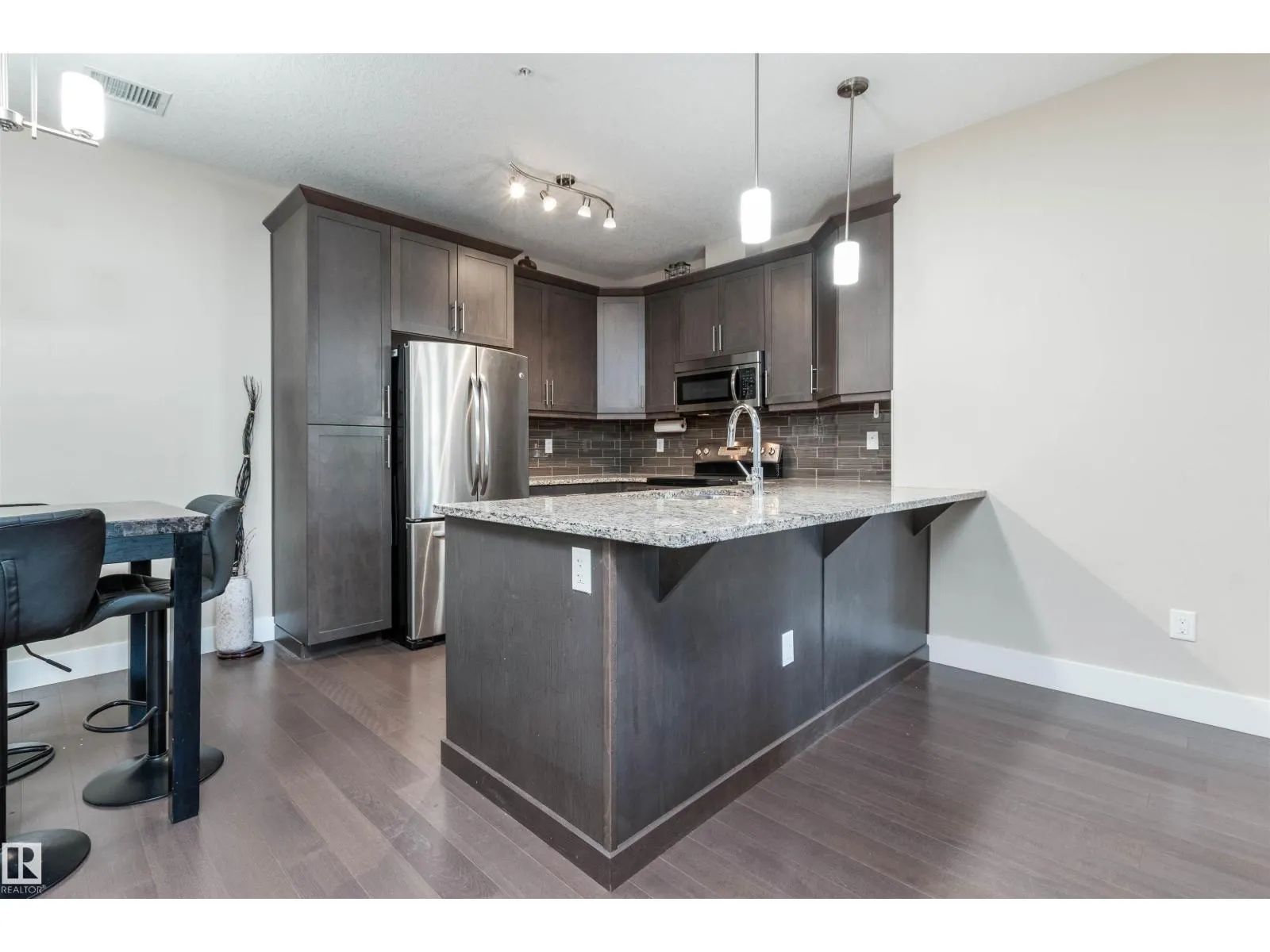 #140 6079 MAYNARD WY NW