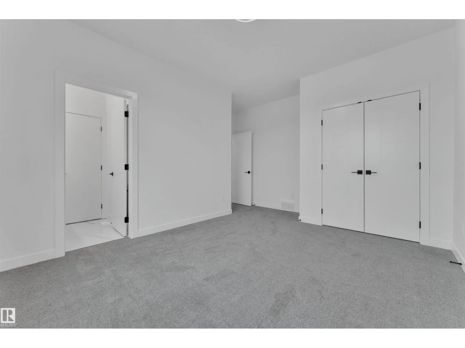 703 166 AV NE