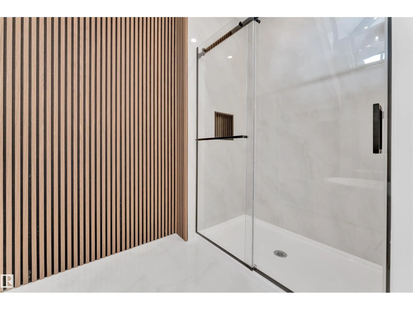 703 166 AV NE