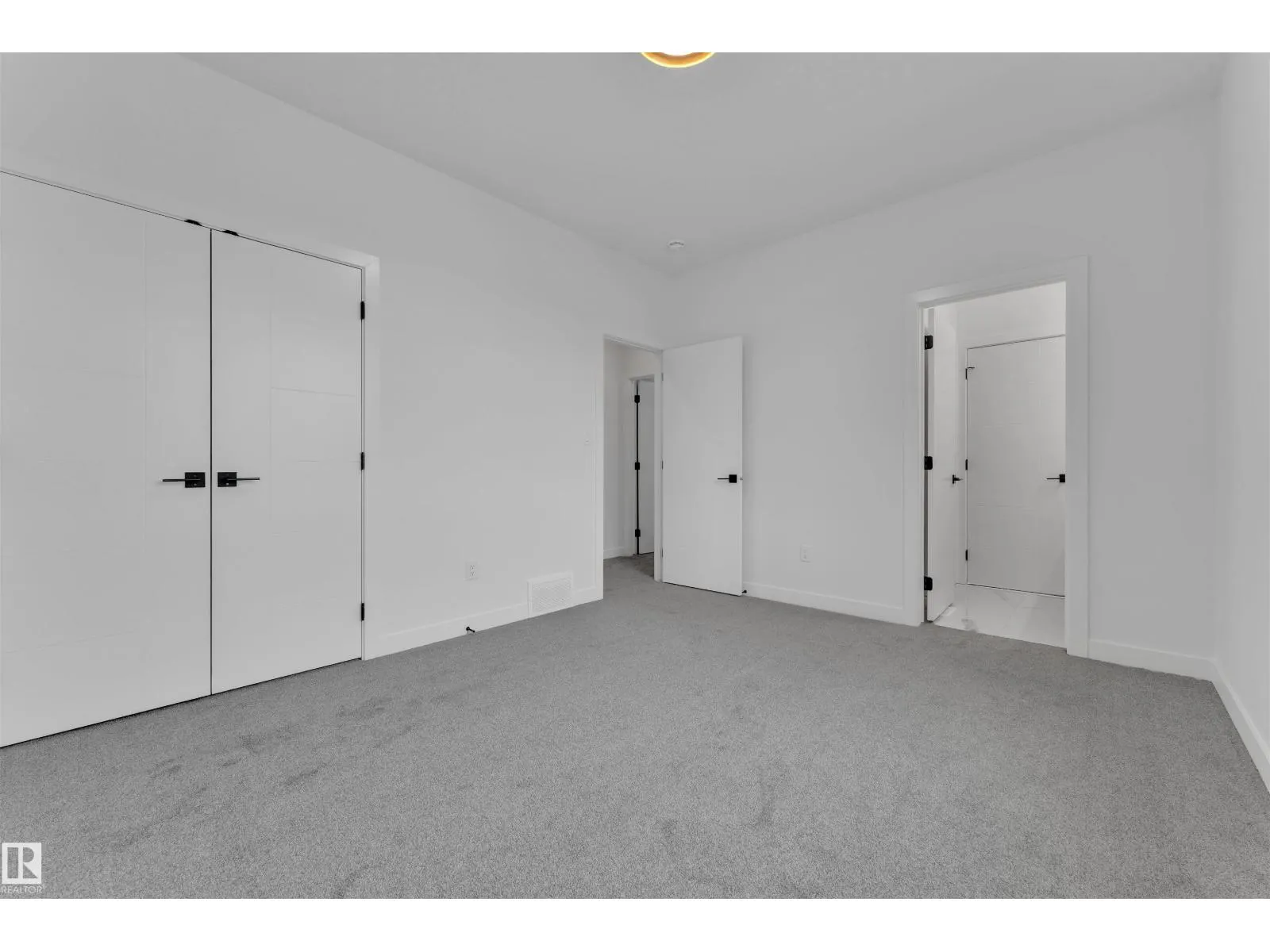 703 166 AV NE
