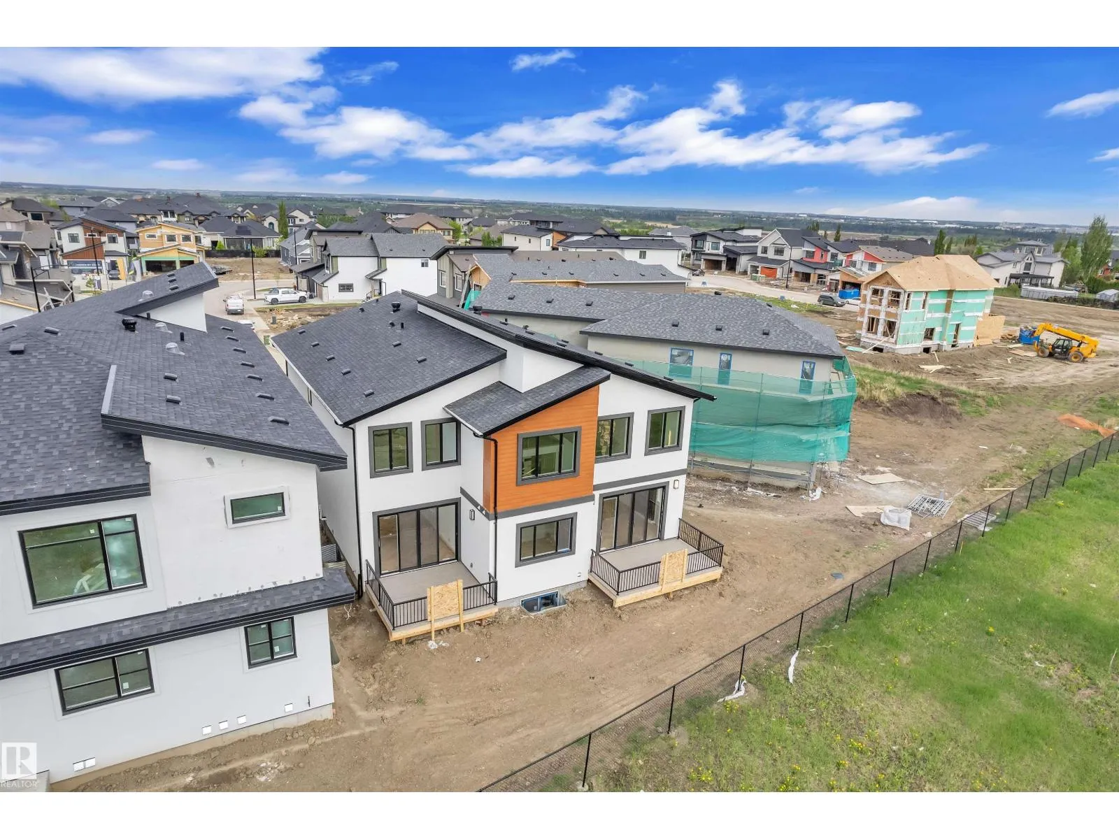 703 166 AV NE