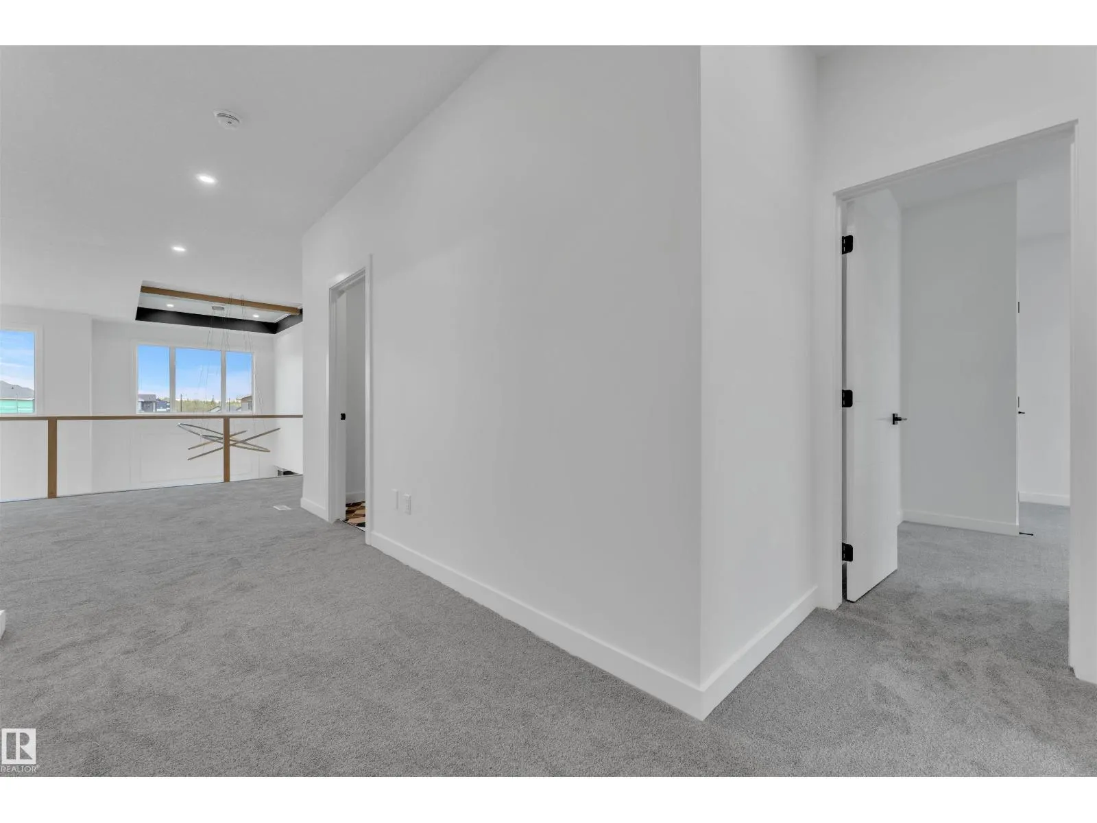 703 166 AV NE