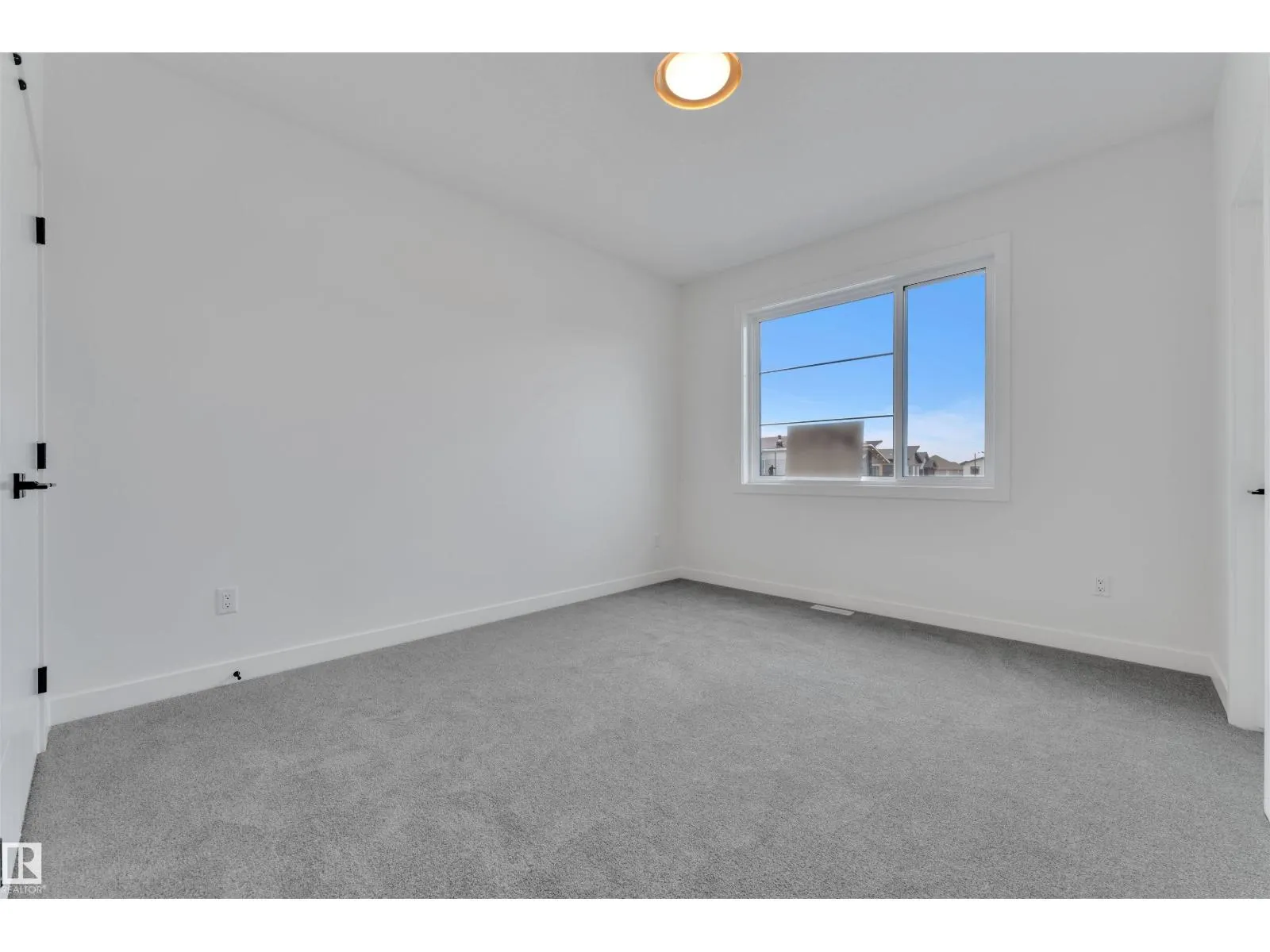 703 166 AV NE