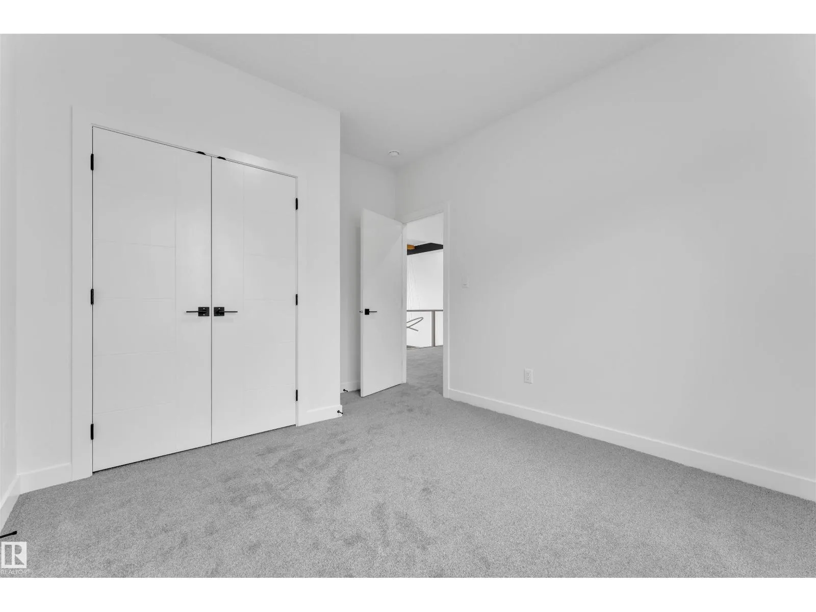 703 166 AV NE