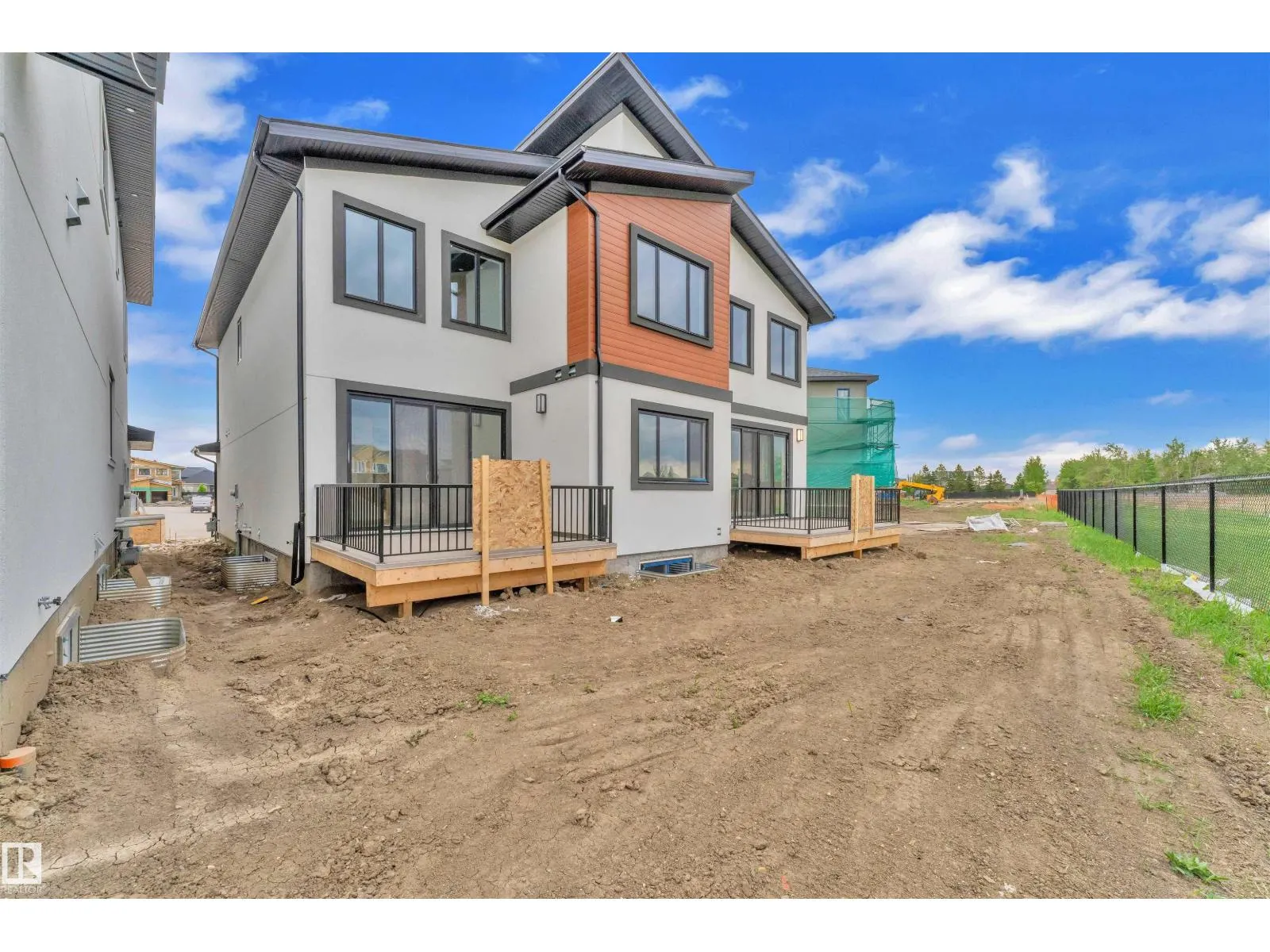703 166 AV NE