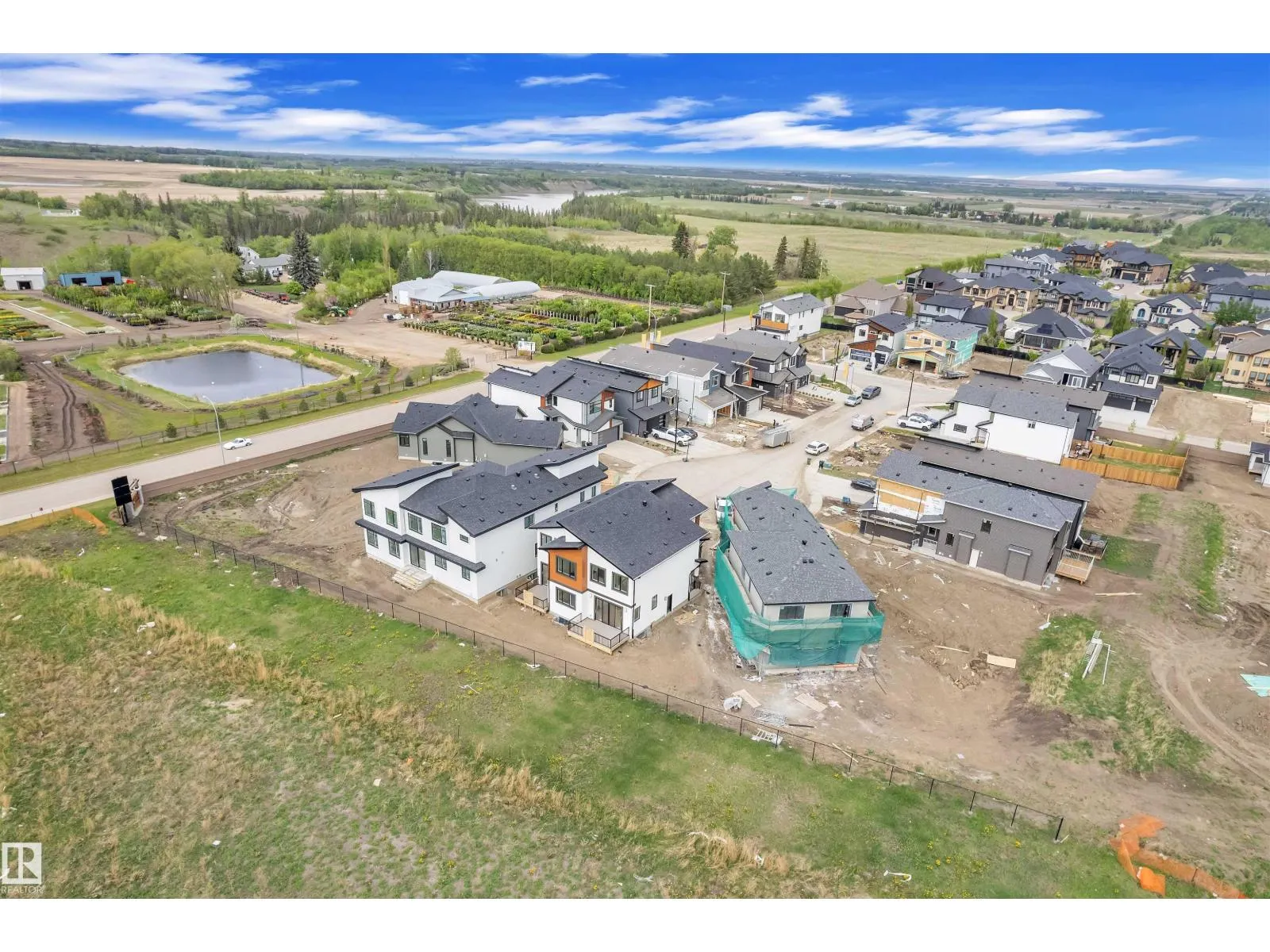 703 166 AV NE