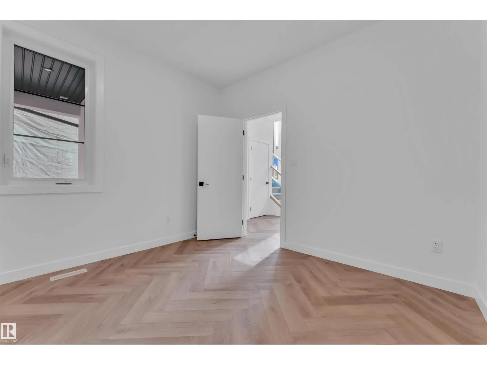 703 166 AV NE