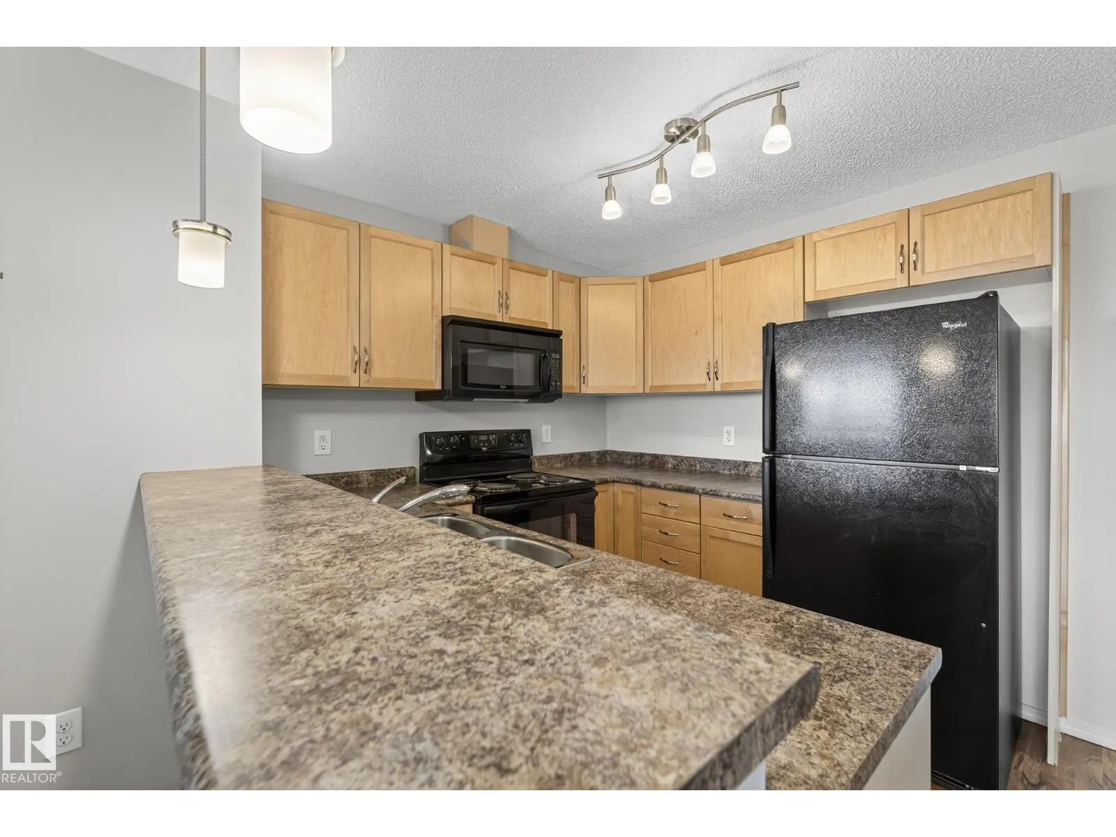 #310 6070 SCHONSEE WY NW