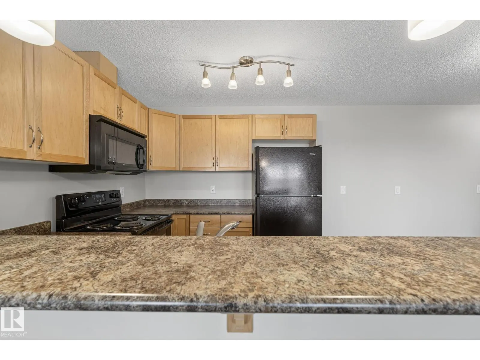 #310 6070 SCHONSEE WY NW