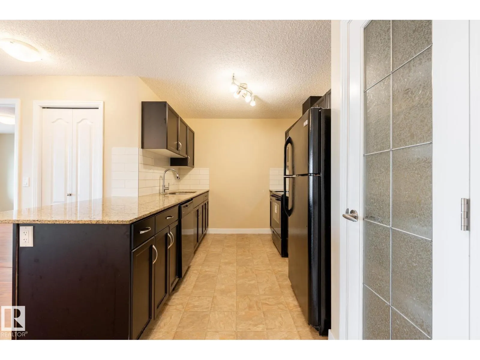 #303 12650 142 AV NW