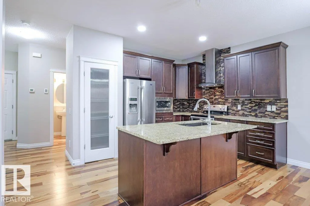 7913 ERASMUS CR NW