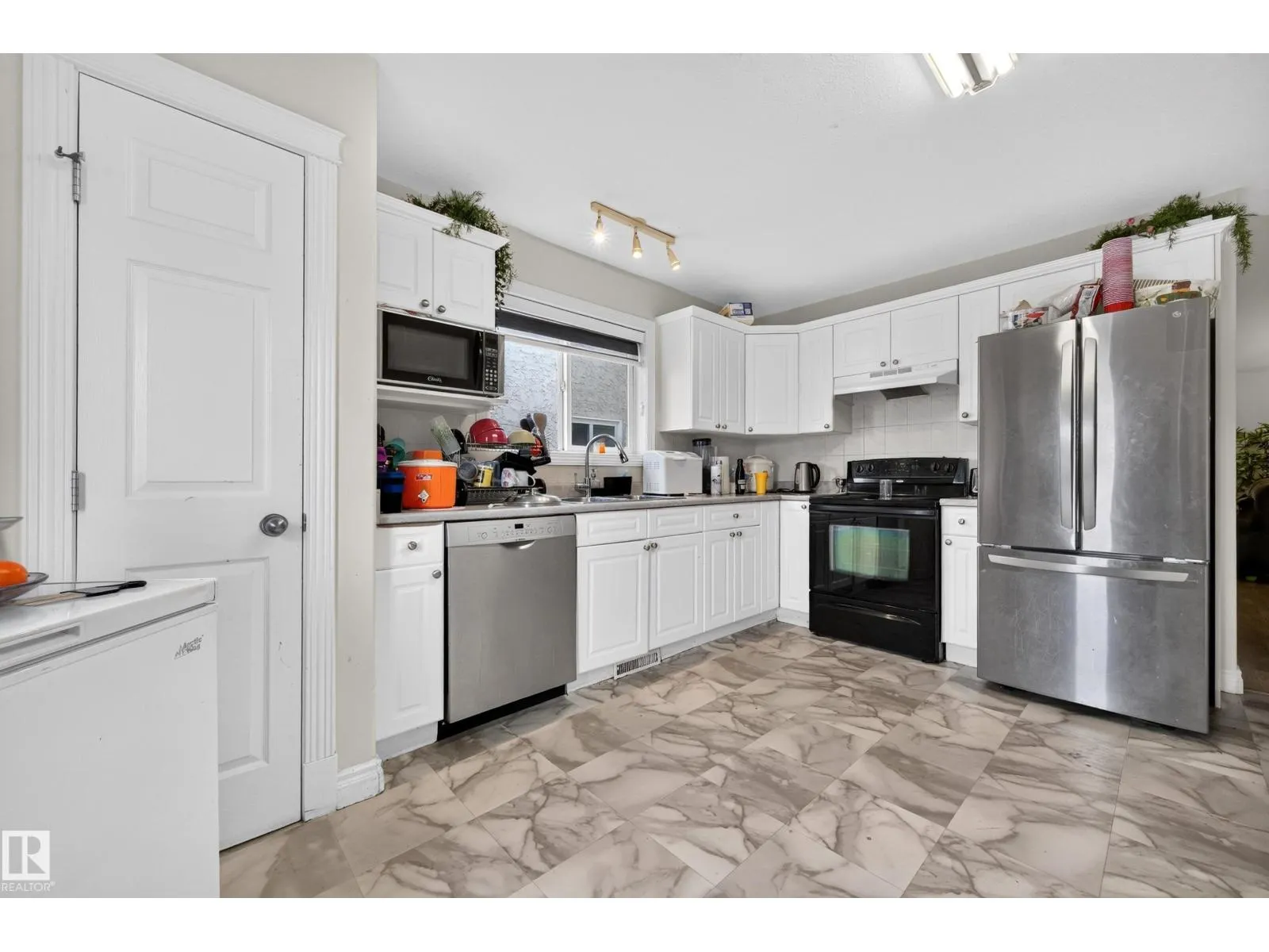 7718 166A AV NW