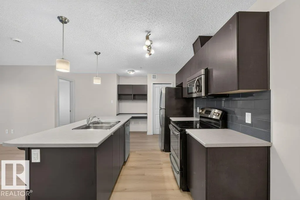 #103 508 ALBANY WY NW